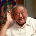 rimpoche hand to ear